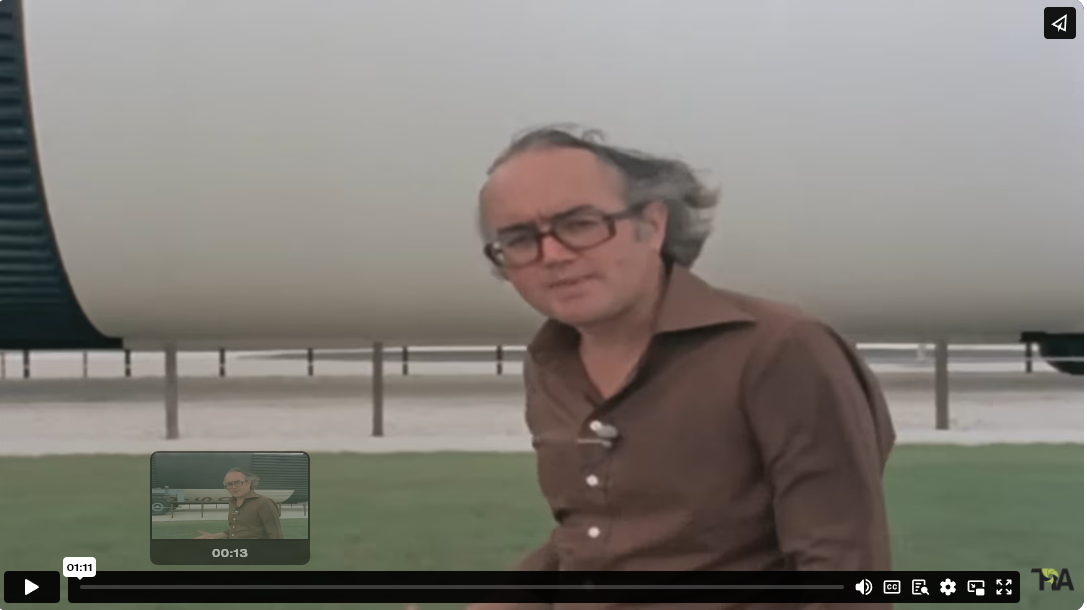 man in front of large rocket