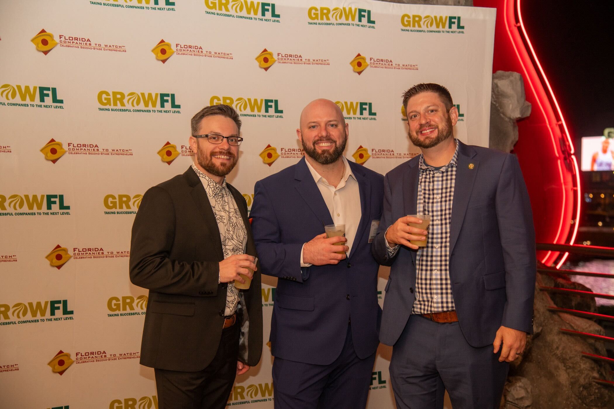 three tra team members at event